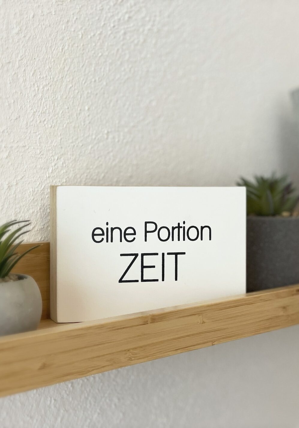 Schild mit "Eine Portion Zeit"